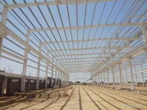 Sustainable steel structure supporting modern green industrial infrastructure and energy-efficient PEB building