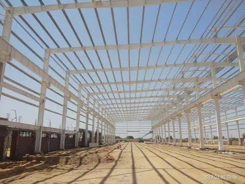 Sustainable steel structure supporting modern green industrial infrastructure and energy-efficient PEB building