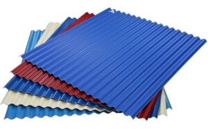 Weather-resistant colour-coated roofing sheets protecting a modern industrial warehouse during heavy rainfall.